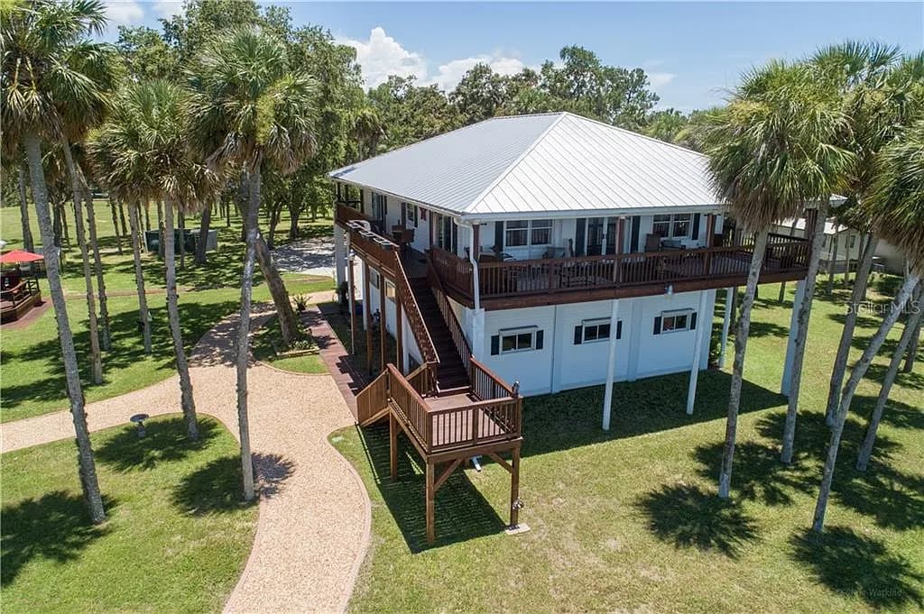 Elevated three-quarter view of the main residence and surrounding grounds