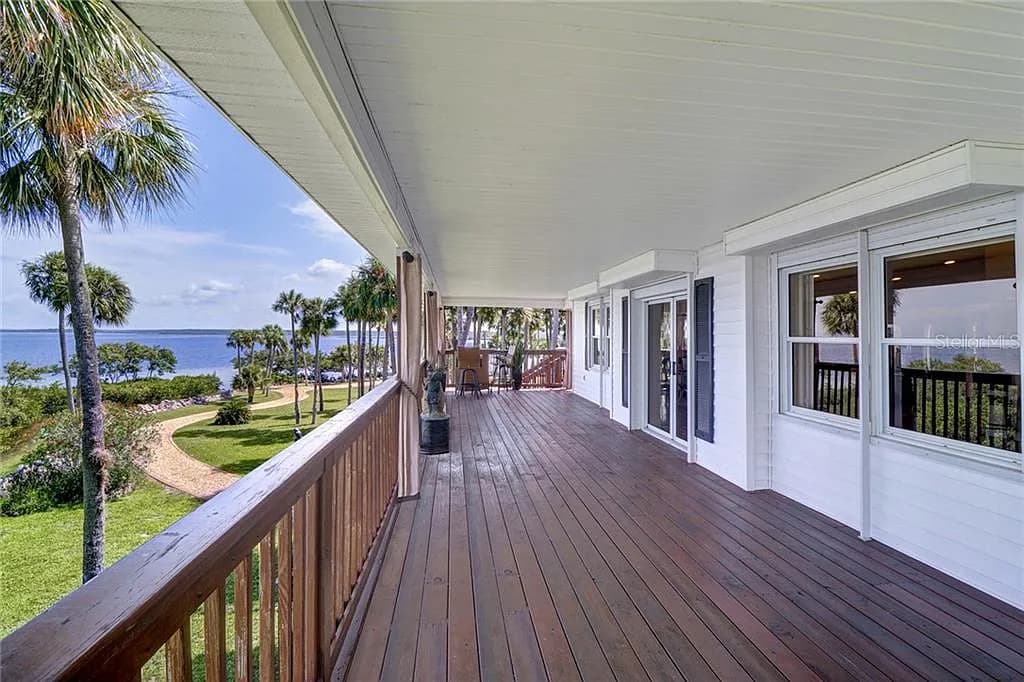 Wraparound porch running the length of the residence, overlooking the Gulf