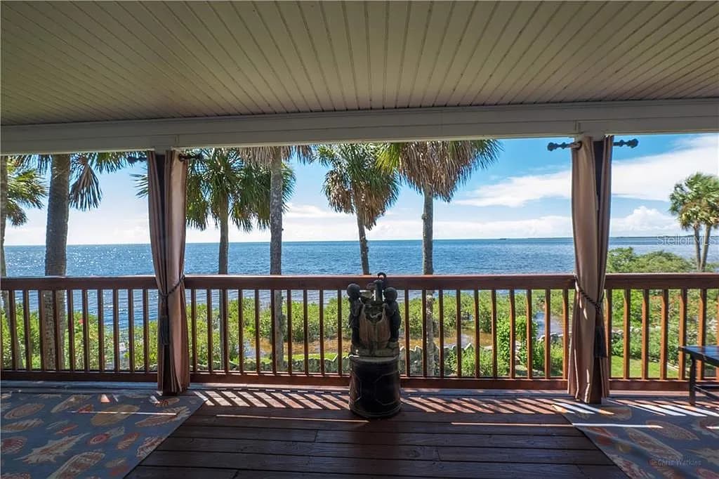 Covered porch looking out over the water frontage