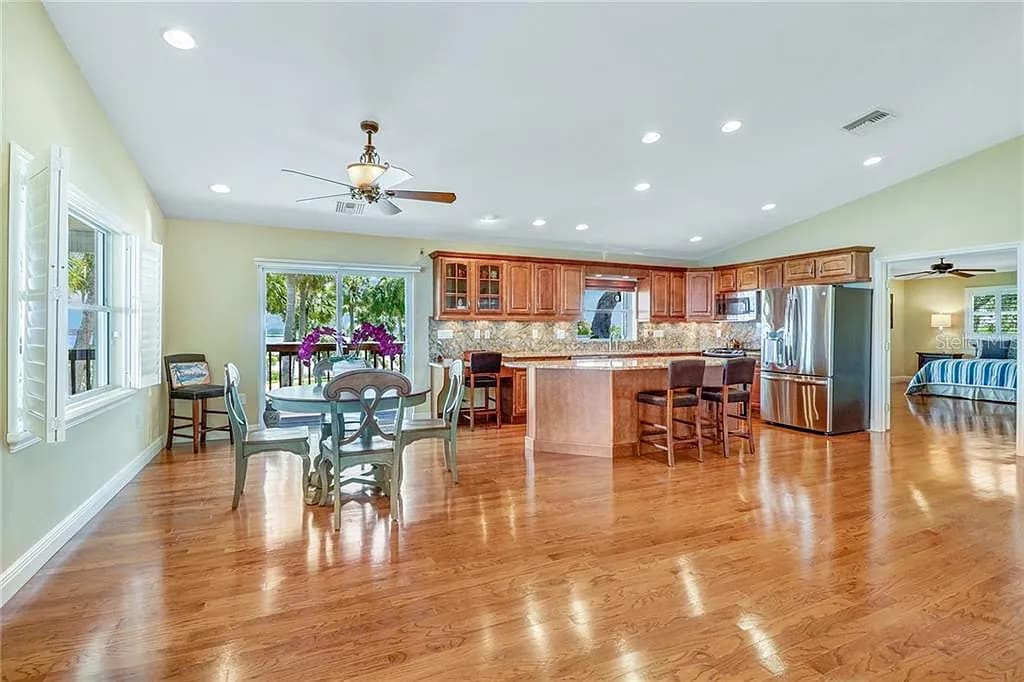 Open kitchen and dining area with hardwood floors